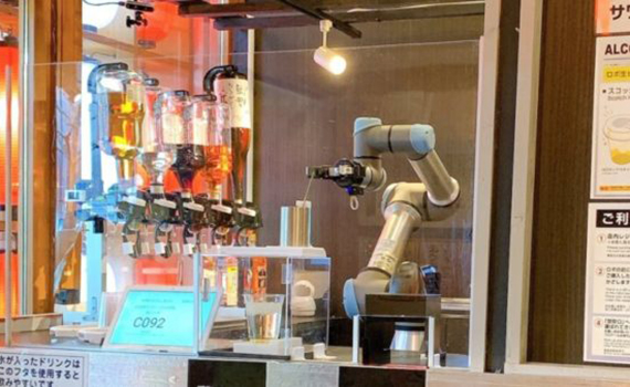A smiling bartender robot is being tested in Japan