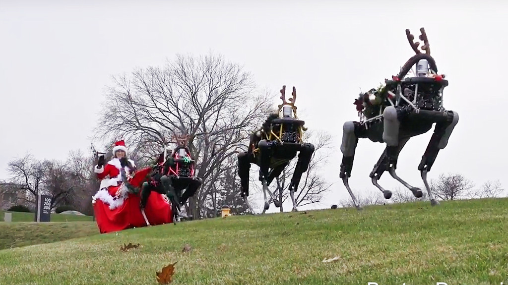 Santa Claus rides robotic dogs